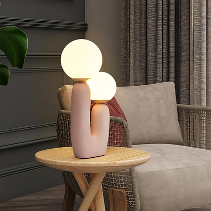 Dvoukulová pryskyřičná stolní lampa v jemných pastelových odstínech