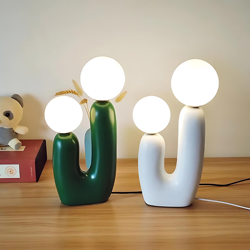 Dvoukulová pryskyřičná stolní lampa v jemných pastelových odstínech