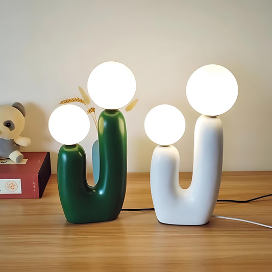 Dvoukulová pryskyřičná stolní lampa v jemných pastelových odstínech