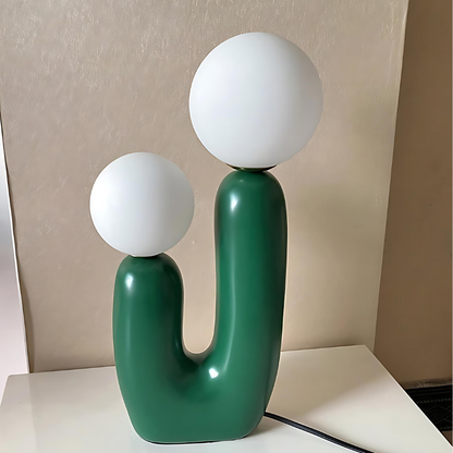 Dvoukulová pryskyřičná stolní lampa v jemných pastelových odstínech
