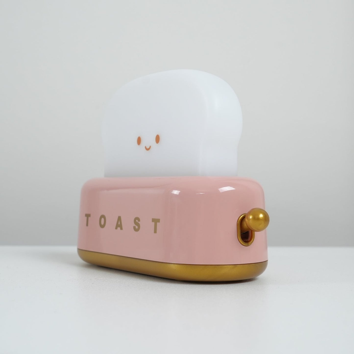 Dobíjecí stolní lampa ve tvaru toustovače
